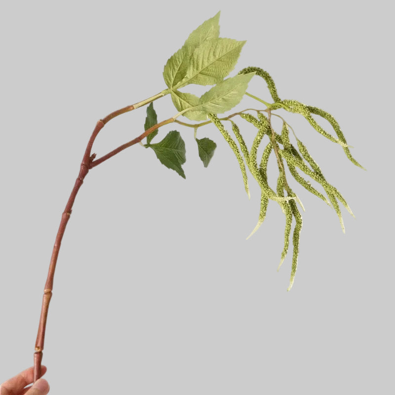 Green cascading artificial amaranthus stem, close-up